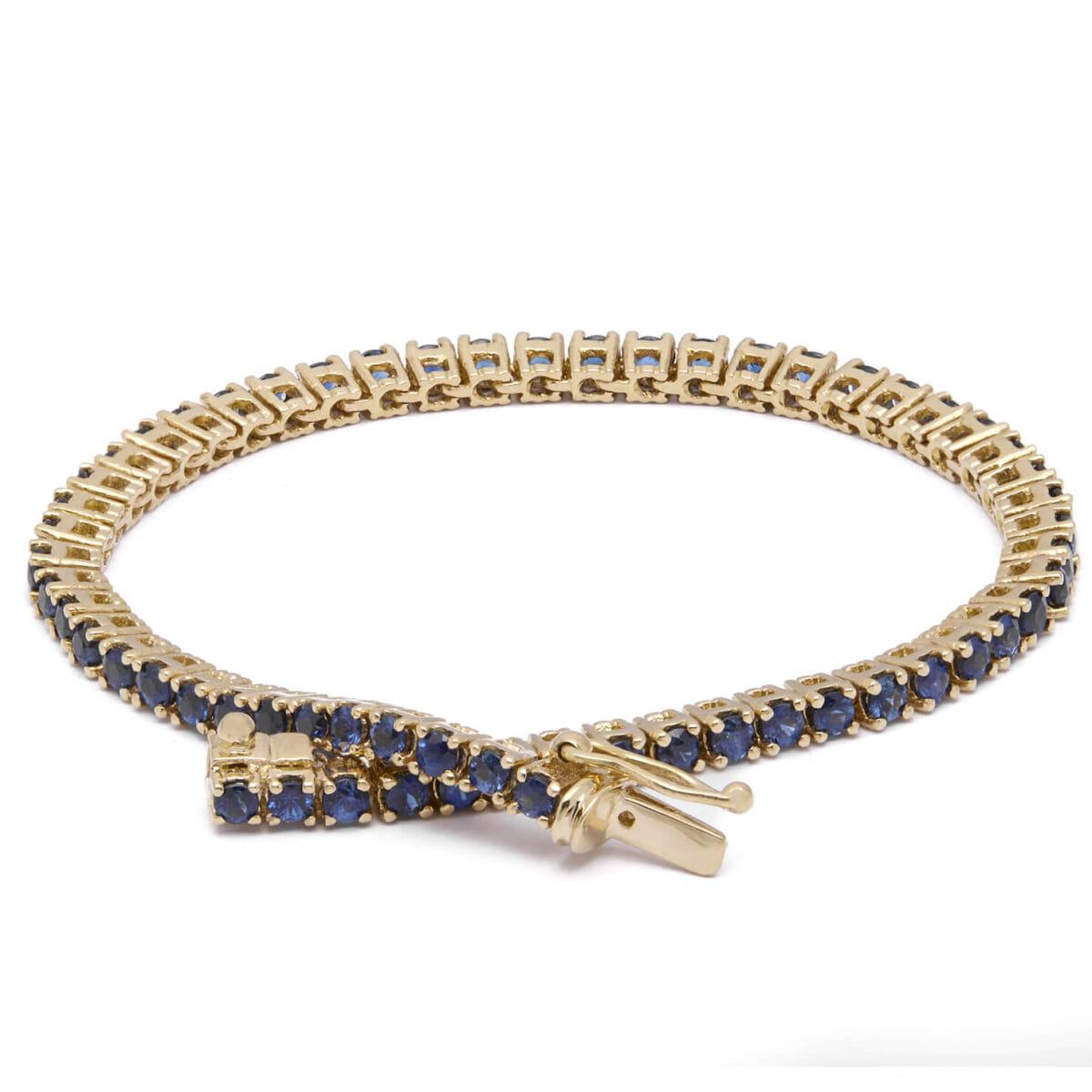 Bracciale tennis in oro giallo 18kt e zaffiri 4,20ct tot