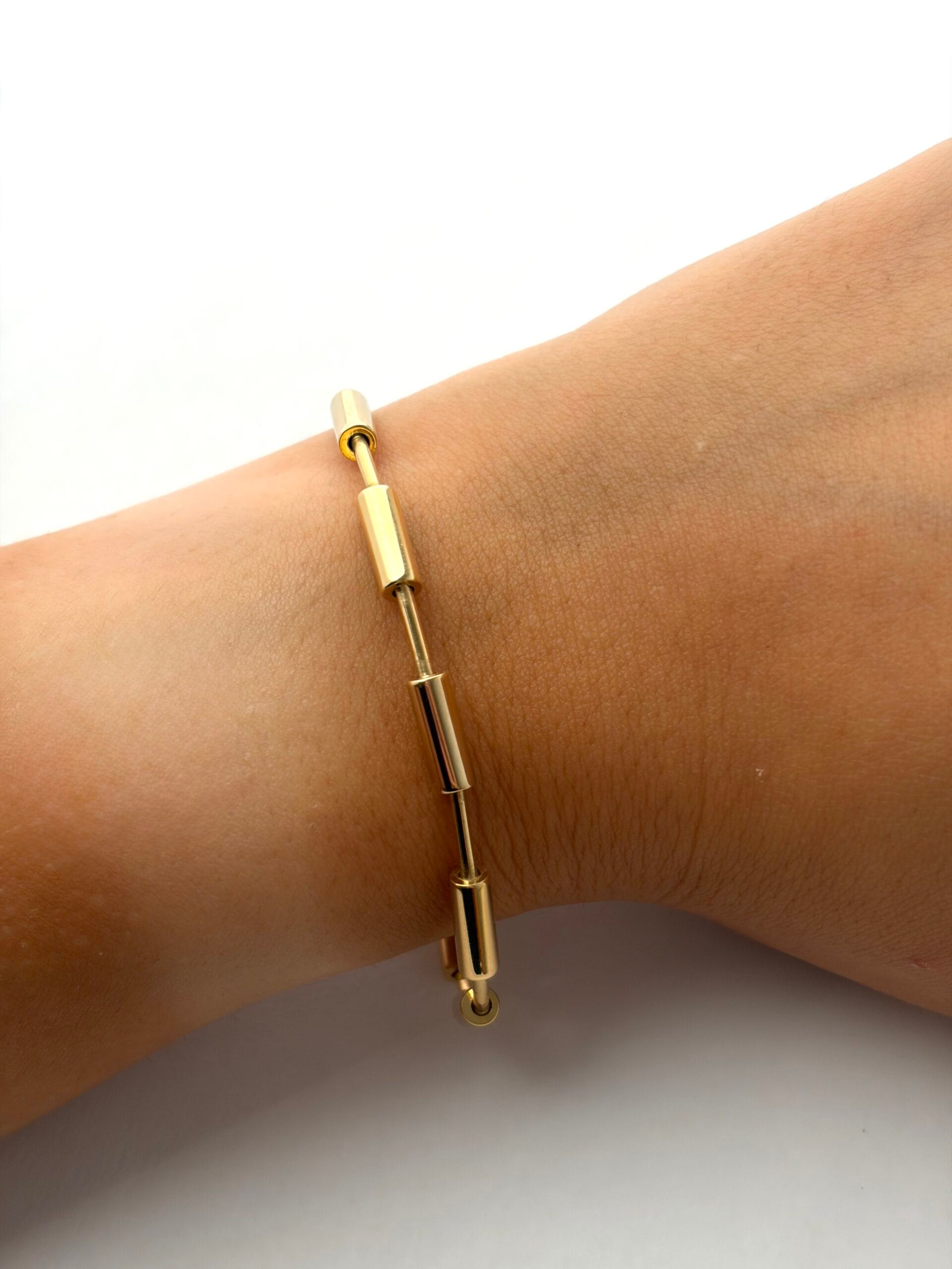 Bracciale a moduli tubolari in oro giallo e bianco-3